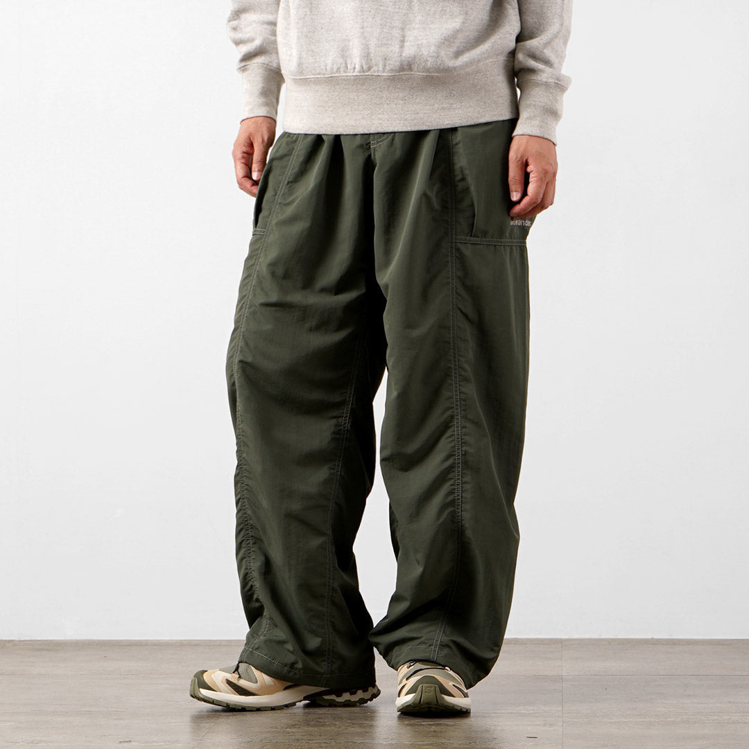 AND WANDER / Crinkle Nylon Pants