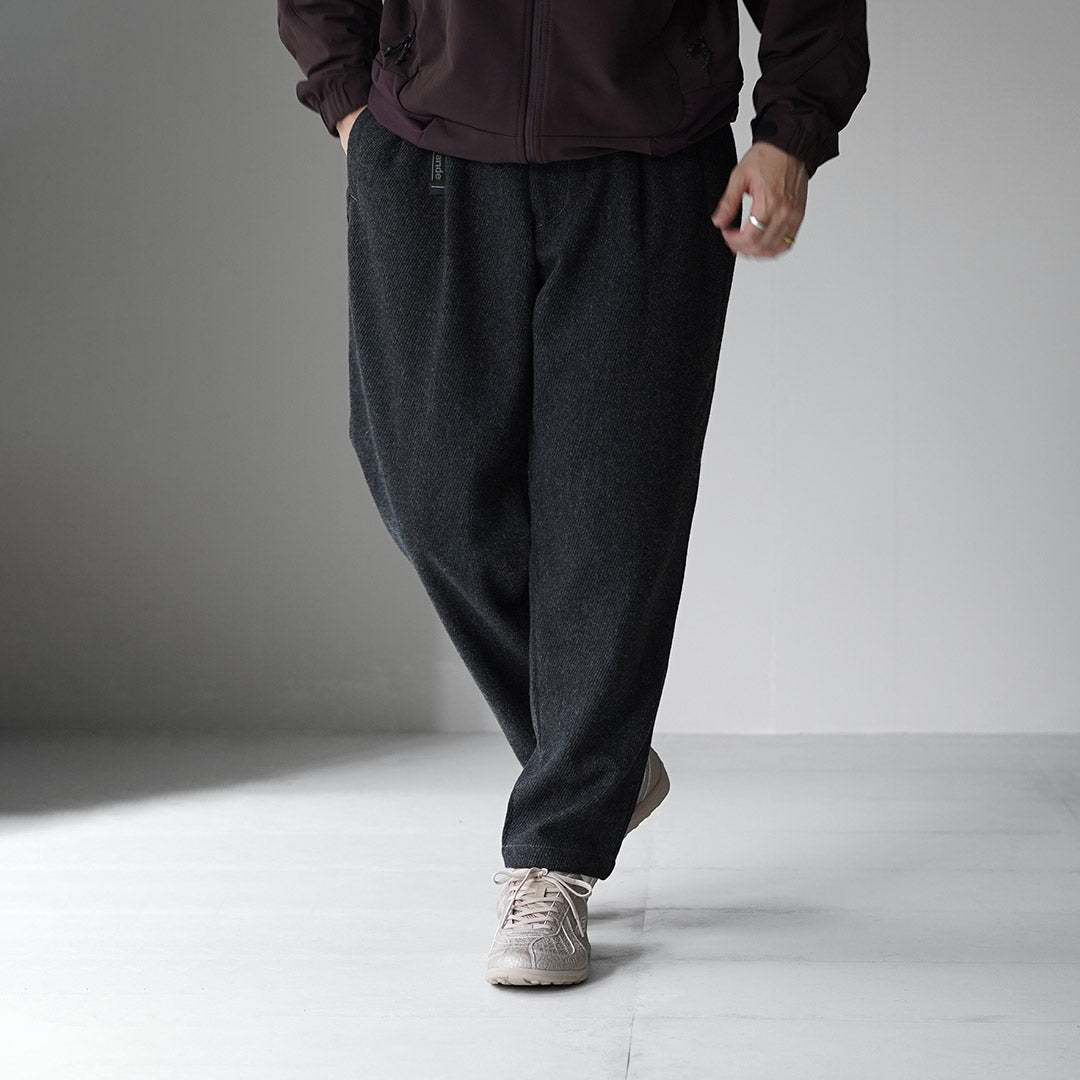 AND WANDER / REWOOL Pantalon fuselé en tweed